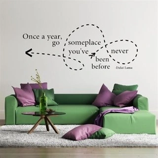 Wallsticker med teksten "Once a year, go someplace..."